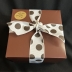 2# Soft Peanut Butter Brittle in a pink and brown box and tied with brown satin ribbon